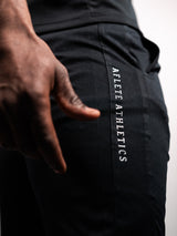 Black AFLETE short-sleeve workout set 007, shorts side wordmark close up