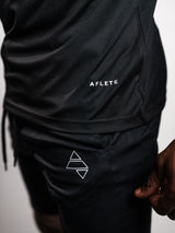 Black AFLETE long-sleeve gym shirt 008, shirt and shorts logo detail