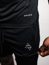 Black AFLETE short-sleeve gym shirt 009, shirt and shorts logo detail