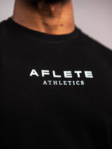 Black AFLETE workout tank top 014, chest logo close up