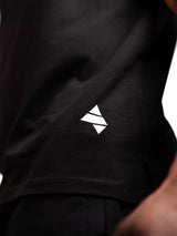 Black AFLETE workout tank top 014, hem logo close up