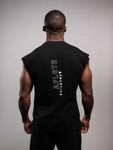 Model wearing the black AFLETE workout tank top 014, tank top back view