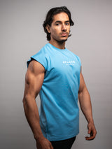 Model wearing the bleu AFLETE workout tank top 014, tank top side view