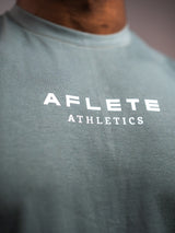 Sage Grey AFLETE workout tank top 014, chest logo close up