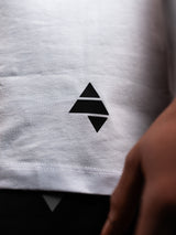 White AFLETE workout tank top 014, hem logo close up