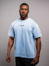Model wearing the blue AFLETE Washed Essential oversized T-shirt 015, tshirt right side view