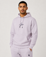 Model wearing the mauve AFLETE Urban hoodie 016, hoodie front hands in pockets