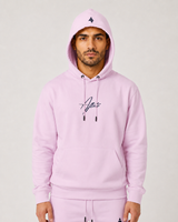 Model wearing the rose pink AFLETE Urban hoodie 016, hood up front view