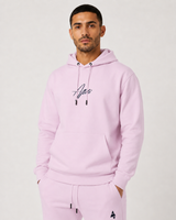 Model wearing the rose pink AFLETE Urban hoodie 016, hoodie front view
