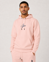 Model wearing the salmon AFLETE Urban hoodie 016, hoodie front view