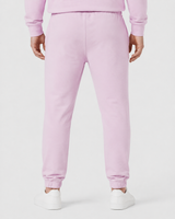 Model wearing the rose pink AFLETE Urban joggers 017, joggers three quarter view