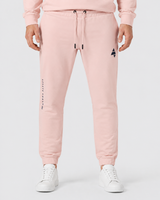 Model wearing the salmon AFLETE Urban joggers 017, joggers front view