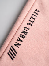 Salmon AFLETE Urban joggers 017, leg wordmark close up