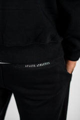 Black AFLETE New Era tracksuit 001, joggers back pocket close up