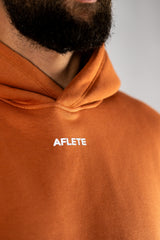Blaze Orange AFLETE New Era tracksuit 001, hoodie chest logo close up