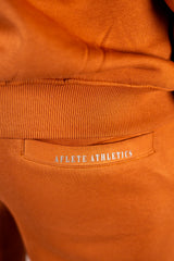 Blaze Orange AFLETE New Era tracksuit 001, joggers back pocket close up