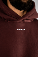 Burgundy AFLETE New Era tracksuit 001, hoodie chest logo close up