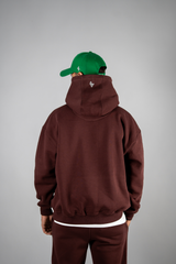 Model wearing the burgundy AFLETE New Era hoodie 002, hoodie back view