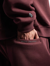 Burgundy AFLETE New Era joggers 003, back pocket logo close up