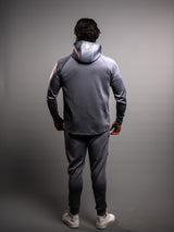 Model wearing the grey AFLETE Tech Series tracksuit 005, full outfit back view