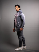Model wearing the grey AFLETE Tech Series tracksuit 005, full outfit side view