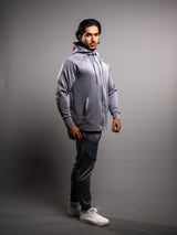 Model wearing the grey AFLETE Tech Series tracksuit 005, full outfit three quarter view