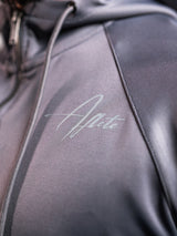Grey AFLETE Tech Series tracksuit 005, jacket chest logo close up