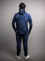 Model wearing the midnight blue AFLETE Tech Series tracksuit 005, full outfit back view