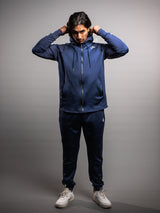 Model wearing the midnight blue AFLETE Tech Series tracksuit 005, full outfit front view