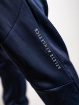 Midnight Blue AFLETE Tech Series tracksuit 005, joggers leg wordmark close up