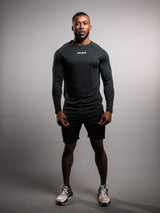 Model wearing the black AFLETE long-sleeve workout set 006, full outfit front view