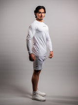 Model wearing the white AFLETE long-sleeve workout set 006, full outfit three quarter view