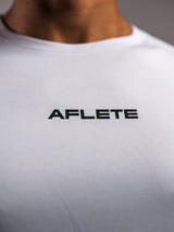 White AFLETE long-sleeve workout set 006, shorts side wordmark close up