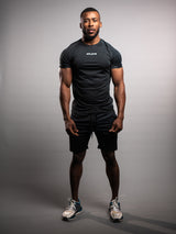 Model wearing the black AFLETE short-sleeve workout set 007, full outfit front view