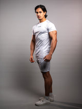 Model wearing the white AFLETE short-sleeve workout set 007, full outfit three quarter view