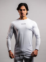 Model wearing the white AFLETE long-sleeve gym shirt 008, shirt front view