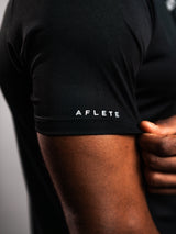 Black AFLETE short-sleeve gym shirt 009, sleeve logo close up
