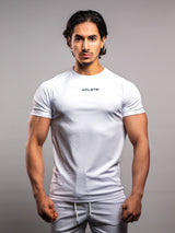 Model wearing the white AFLETE short-sleeve gym shirt 009, shirt front view