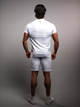 Model wearing the white AFLETE short-sleeve gym shirt 009, shirt three quarter view