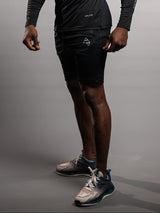 Model wearing the black AFLETE Tech Series gym shorts 010, shorts three quarter view