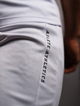 Model wearing the white AFLETE Tech Series gym shorts 010, shorts on model front view