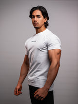 Model wearing the white AFLETE Essential Urban T-shirt 011, tshirt back view