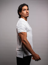 Model wearing the white AFLETE Essential Urban T-shirt 011, tshirt side view