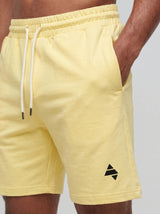 Yellow AFLETE Essential Urban shorts 012, logo and waistband close up