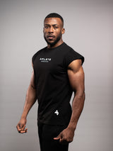 Model wearing the black AFLETE workout tank top 014, tank top three quarter view