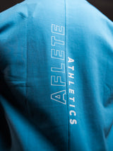 Bleu AFLETE workout tank top 014, hem logo close up