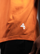 Orange AFLETE workout tank top 014, hem logo close up