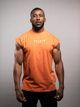 Model wearing the orange AFLETE workout tank top 014, tank top front view