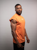 Model wearing the orange AFLETE workout tank top 014, tank top side view
