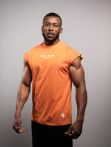 Model wearing the orange AFLETE workout tank top 014, tank top three quarter view